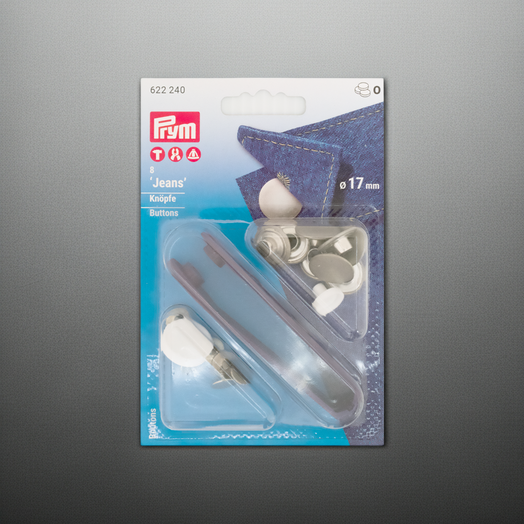 Prym Jeansknöpfe nähfrei, Ø 17 mm in silber und mit Werkzeug in der Blister Verpackung auf silbergrauem Hintergrund